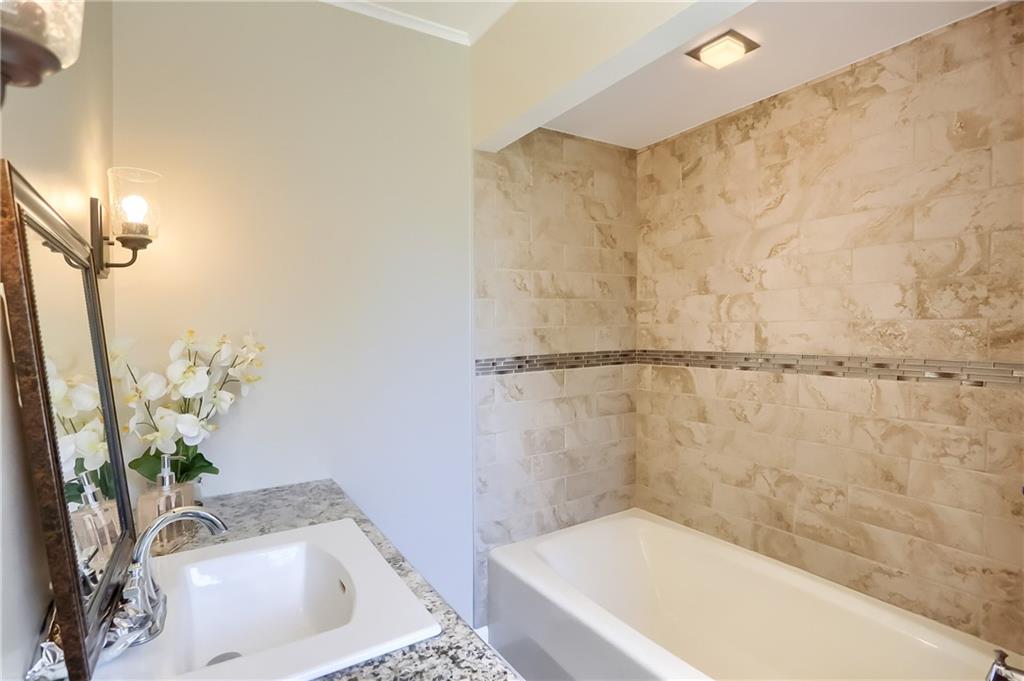 610 Dick Road Renfrew, PA 16001 - Photo 12 of 25 a bathroom with a sink a bathtub and shower