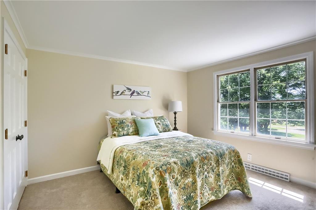 610 Dick Road Renfrew, PA 16001 - Photo 14 of 25 a large bed sitting in a bedroom next to a window