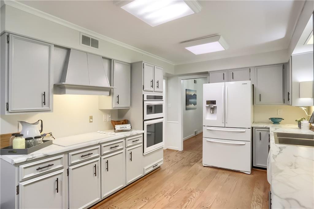 610 Dick Road Renfrew, PA 16001 - Photo 6 of 25 a kitchen with white cabinets and white stainless steel appliances