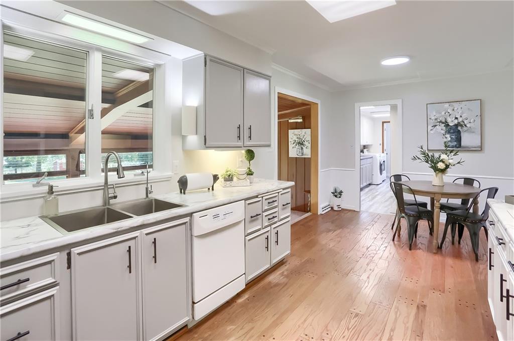 610 Dick Road Renfrew, PA 16001 - Photo 7 of 25 a kitchen with white cabinets and sink