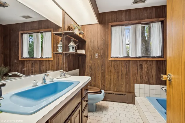 a bathroom with a tub and a sink