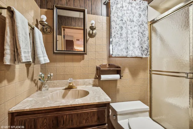 a bedroom with a large bed and a large window