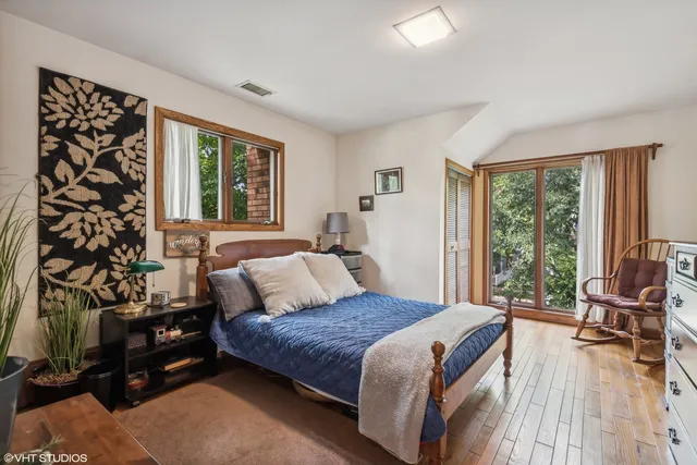 a bedroom with furniture and a window