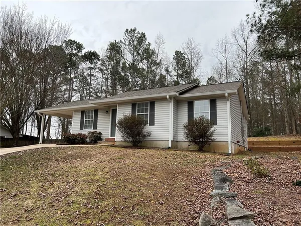 a front view of house with yard outdoor seating and barbeque oven