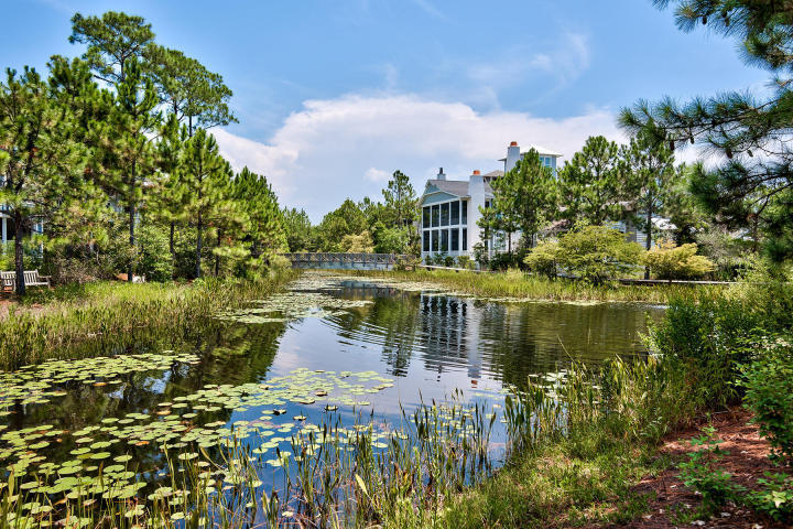 37 Compass Point Way South, Unit 420 Watersound, FL 32461 - Photo 23 of 24 a view of a lake with a building in the background