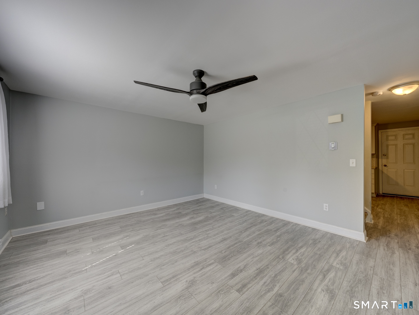 2 Branch Road, Unit 2C Thomaston, CT 06787 - Photo 2 of 26 wooden floor in an empty room with a window
