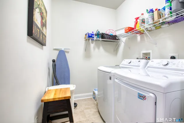 a utility room with dryer and washer