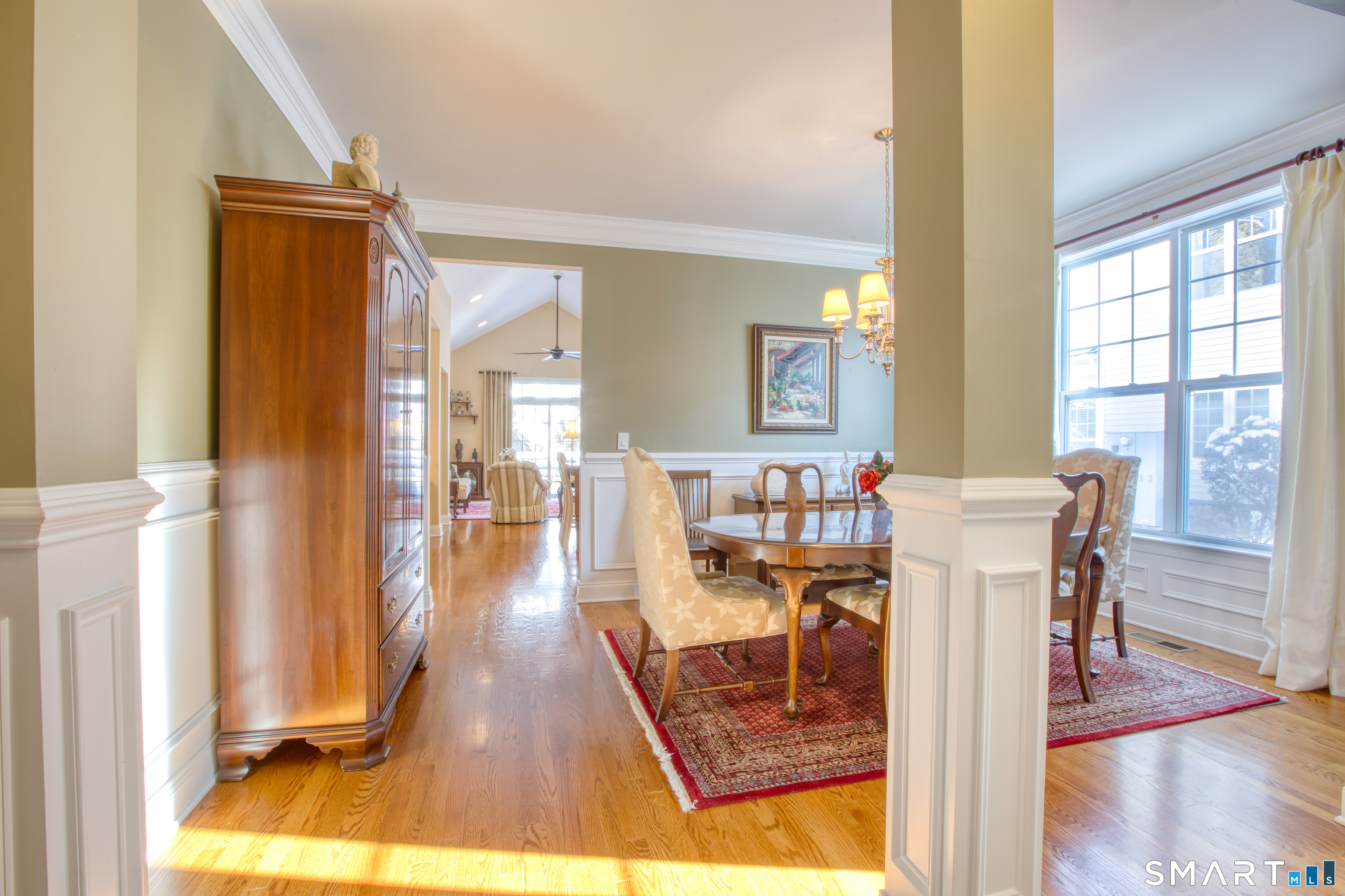 12 Briar Ridge Drive, Unit 12 Bethel, CT 06801 - Photo 5 of 34 a dining room with wooden floor and large windows