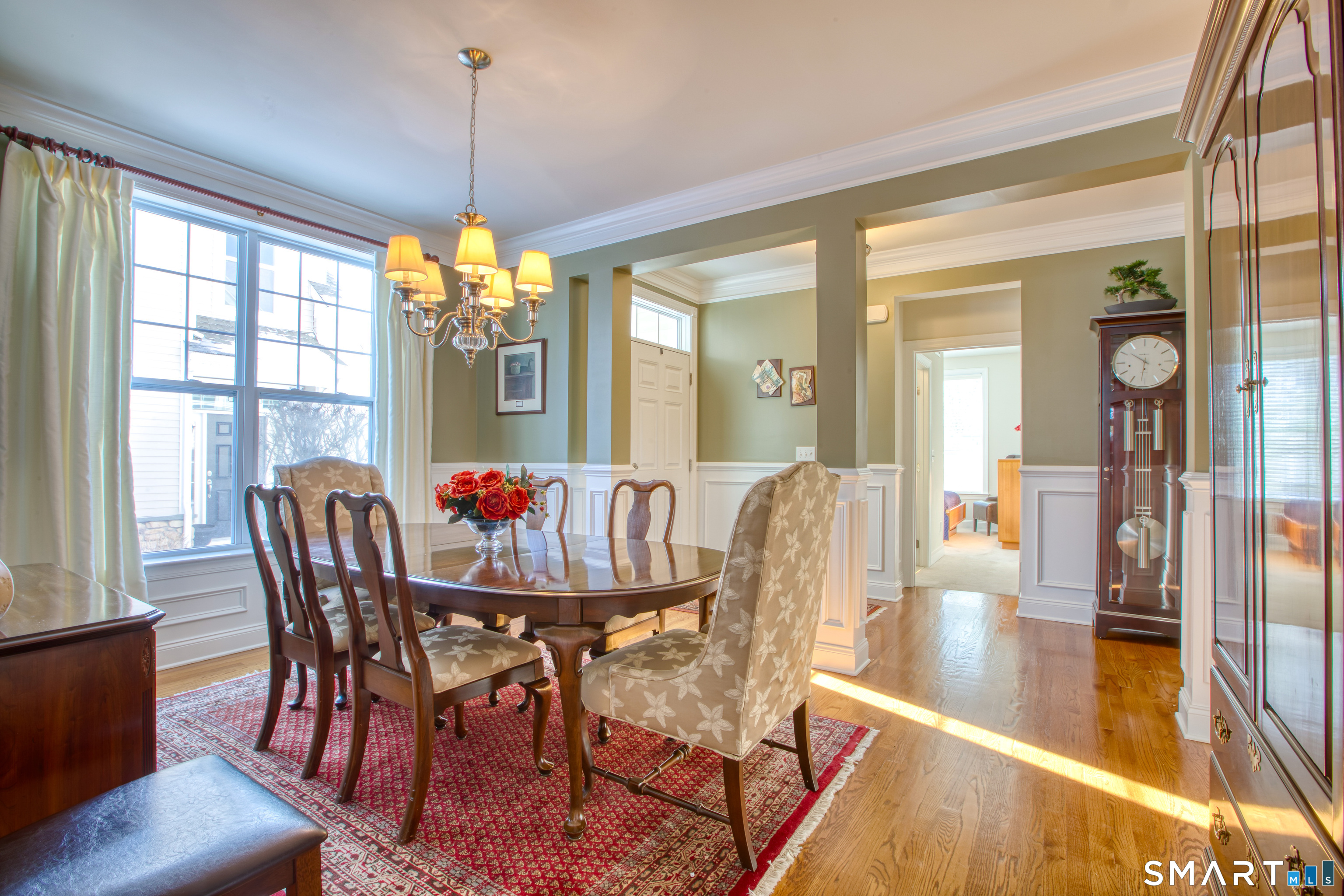 12 Briar Ridge Drive, Unit 12 Bethel, CT 06801 - Photo 6 of 34 a dining room with furniture a chandelier and wooden floor