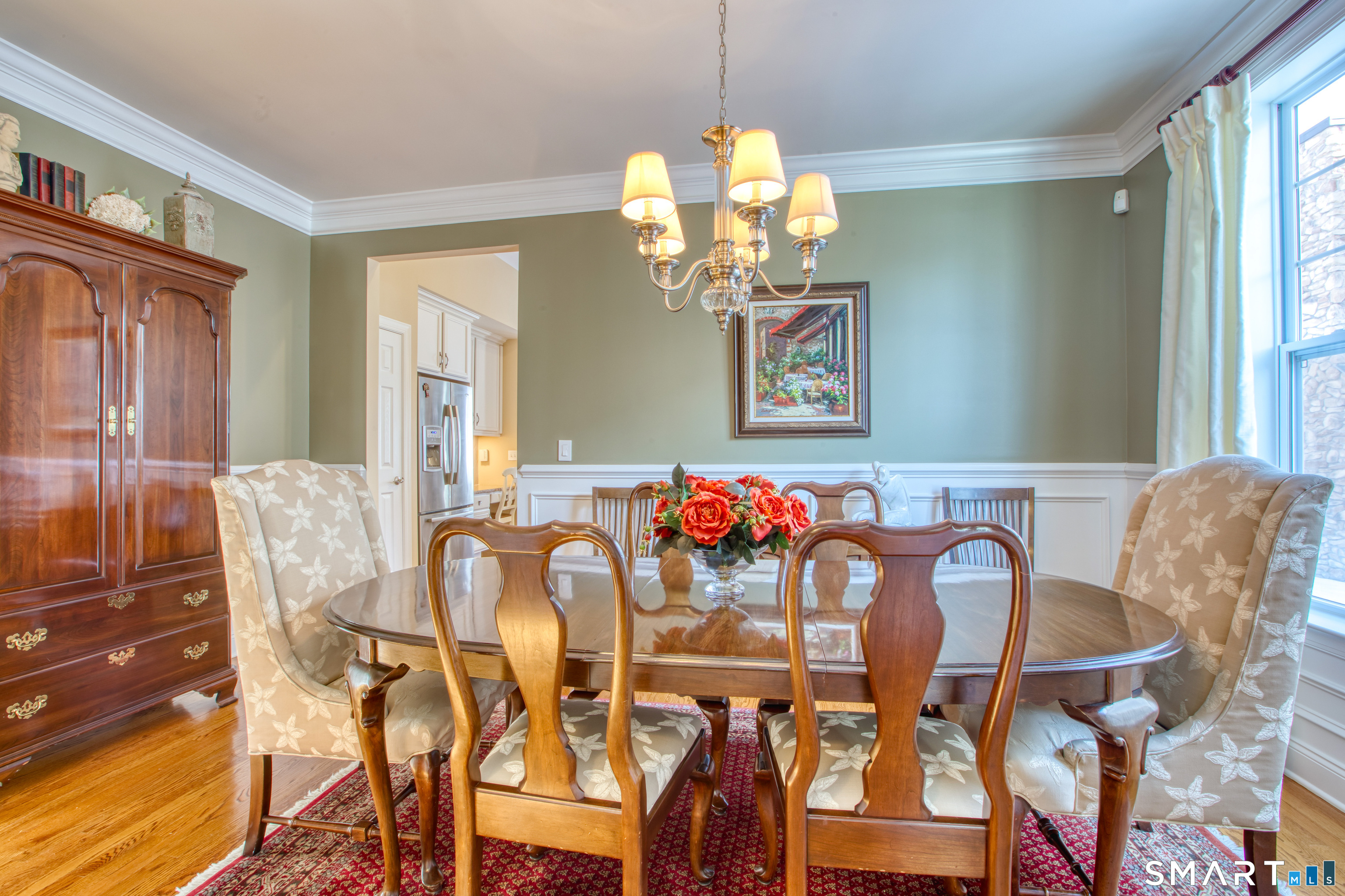 12 Briar Ridge Drive, Unit 12 Bethel, CT 06801 - Photo 7 of 34 a view of a dining room with furniture and chandelier