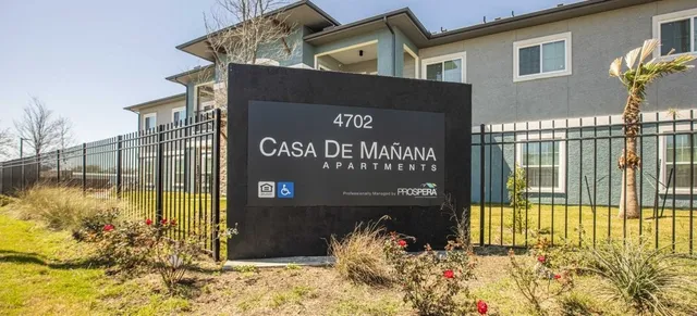 a view of a house with a flower garden