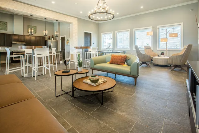 a living room with furniture and a lamp