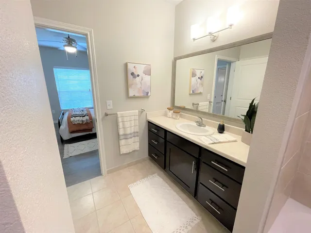 a bathroom with a double vanity sink a and a mirror