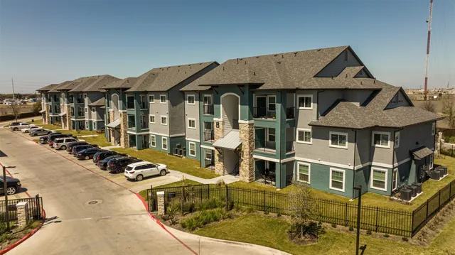 a front view of a house with large windows