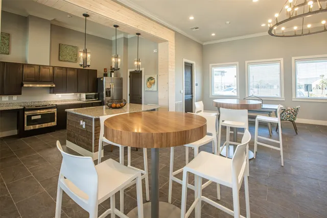 a living room with furniture a window and a table