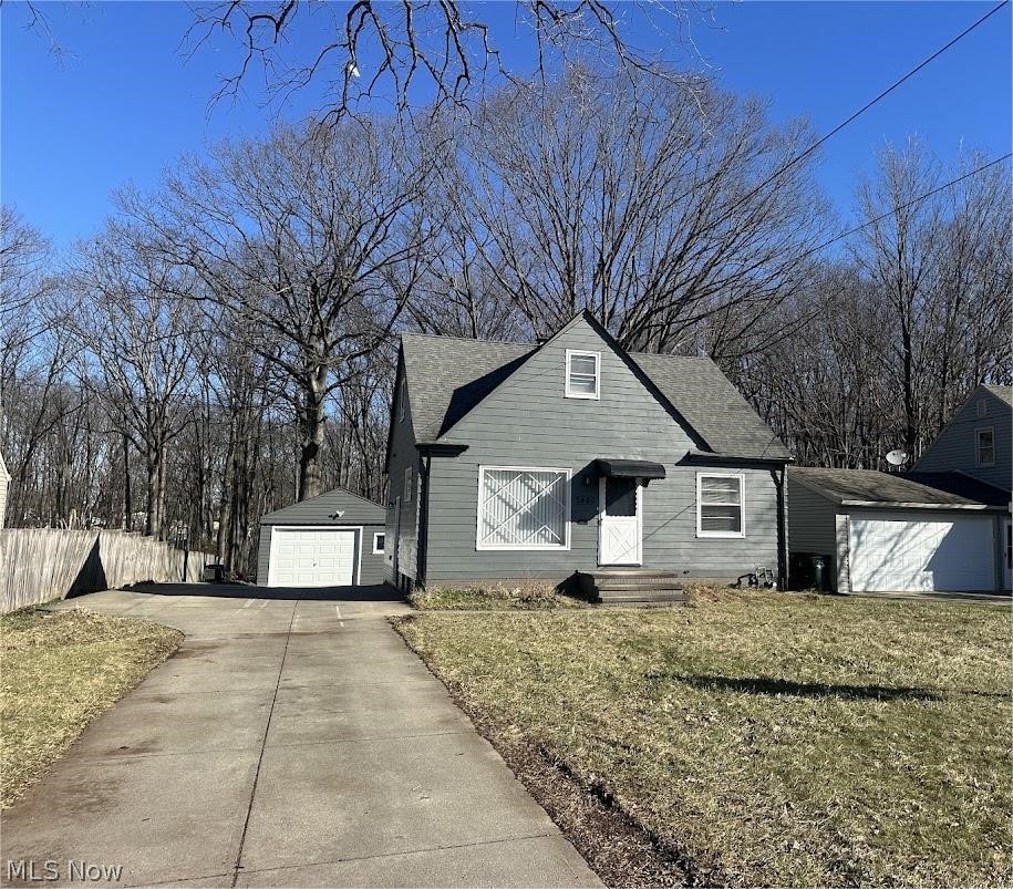 2440 Dentzler Road Parma, OH 44134 - Photo 1 of 11 View of front of property with an outdoor structure and a detached garage