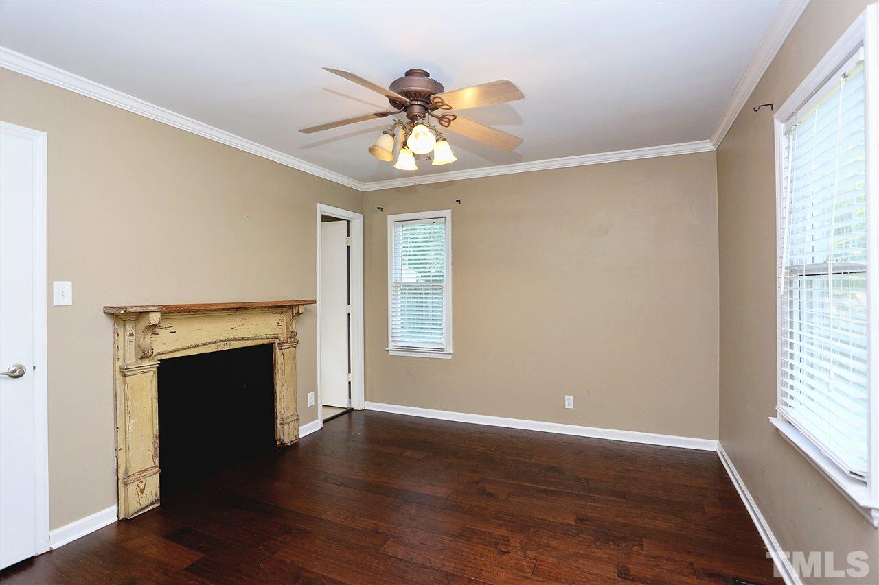 2617 Kirk Road Durham, NC 27705 - Photo 14 of 25 Master Bed with Decorate Mantle, Walk In Closet, and Ceiling Fan with Private Bath