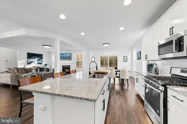 a dining room with furniture and wooden floor