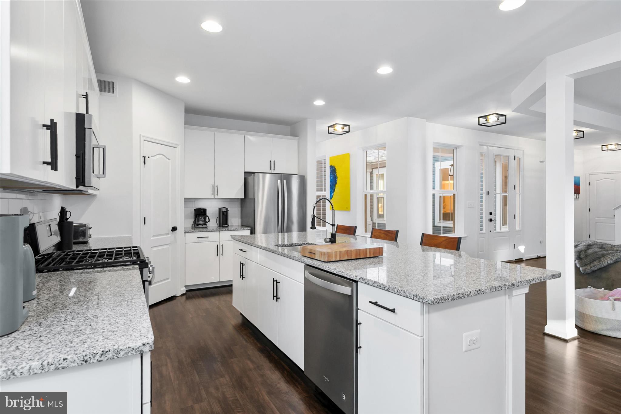 36114 Watch Hill Road Frankford, DE 19945 - Photo 13 of 80 a kitchen with stainless steel appliances granite countertop a sink stove and refrigerator