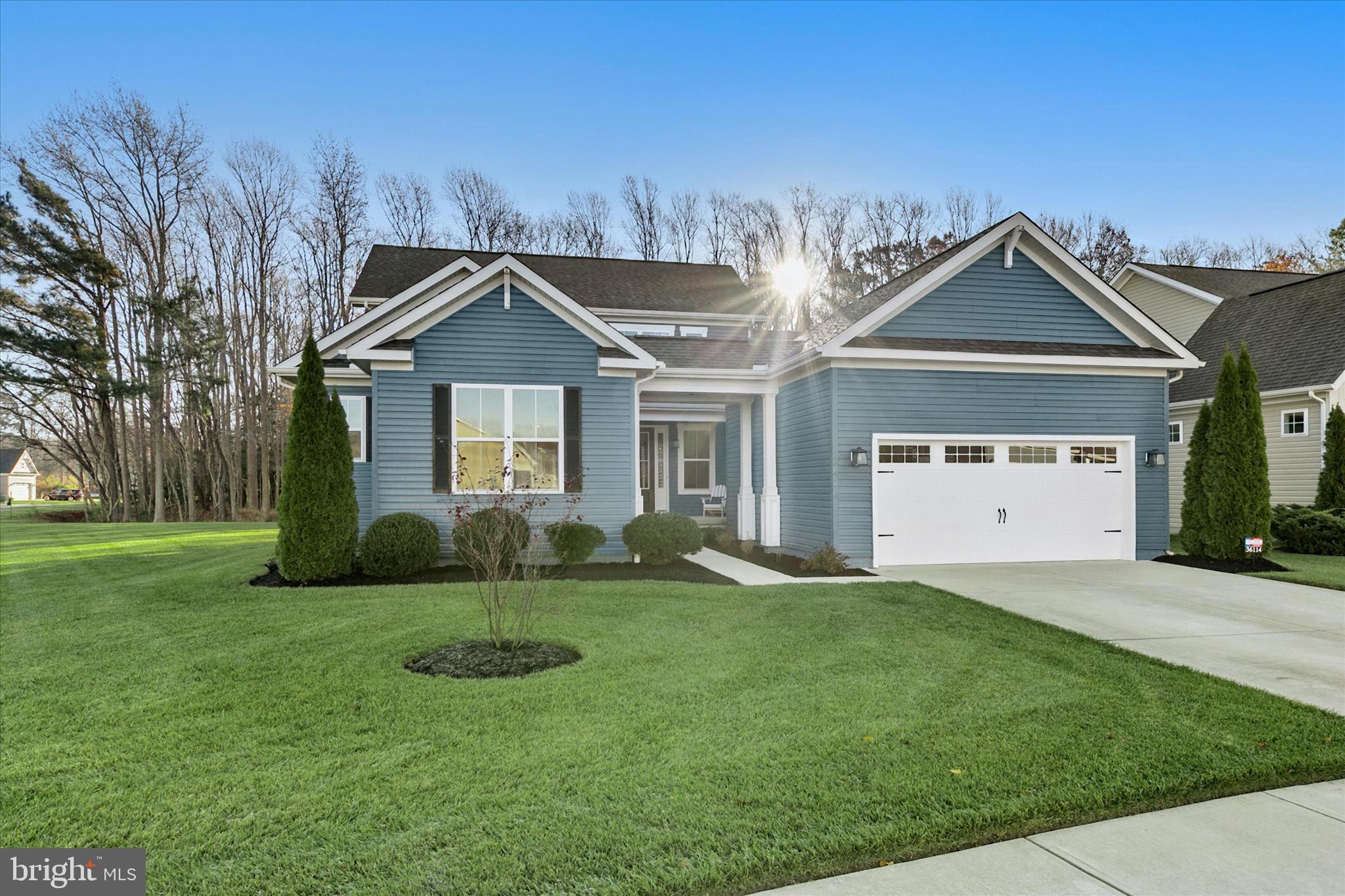36114 Watch Hill Road Frankford, DE 19945 - Photo 2 of 80 a front view of a house with a yard and garage