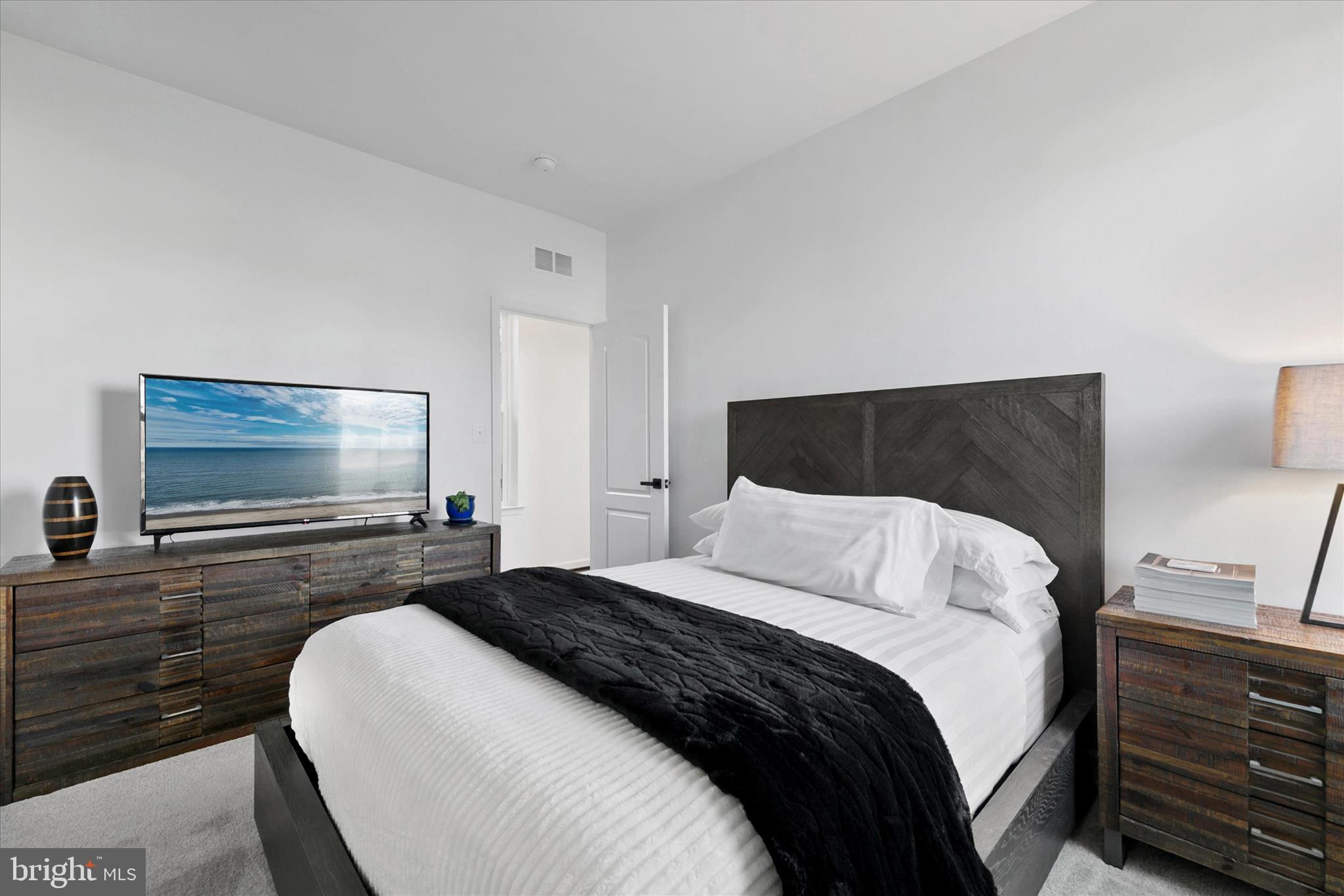 36114 Watch Hill Road Frankford, DE 19945 - Photo 25 of 80 a bedroom with a bed and a flat screen tv