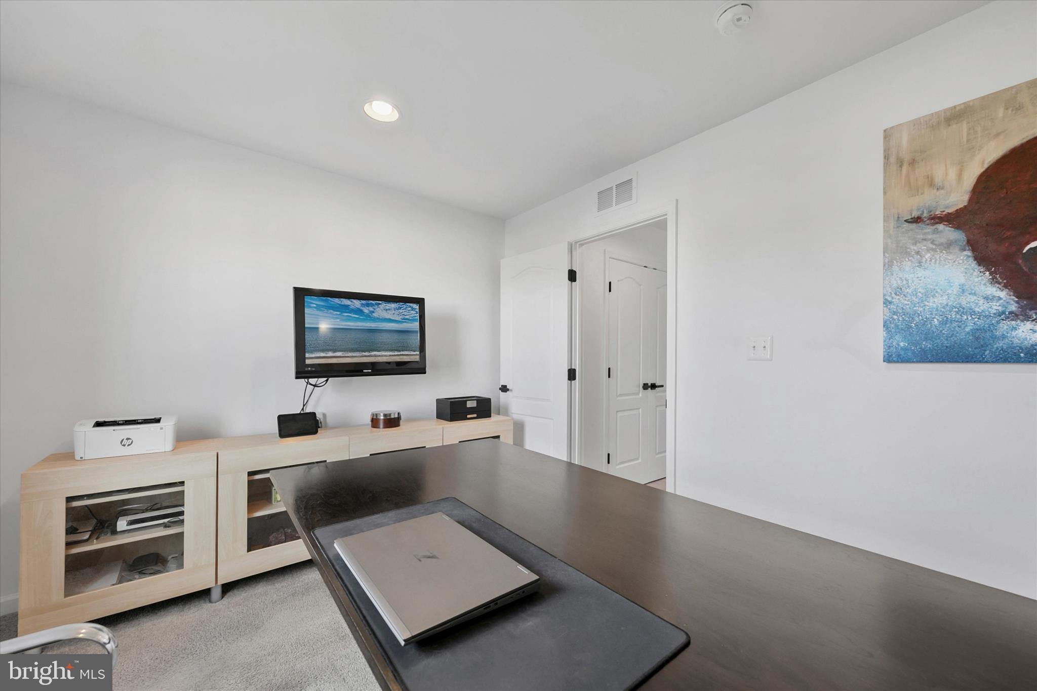 36114 Watch Hill Road Frankford, DE 19945 - Photo 31 of 80 a living room with furniture and a flat screen tv