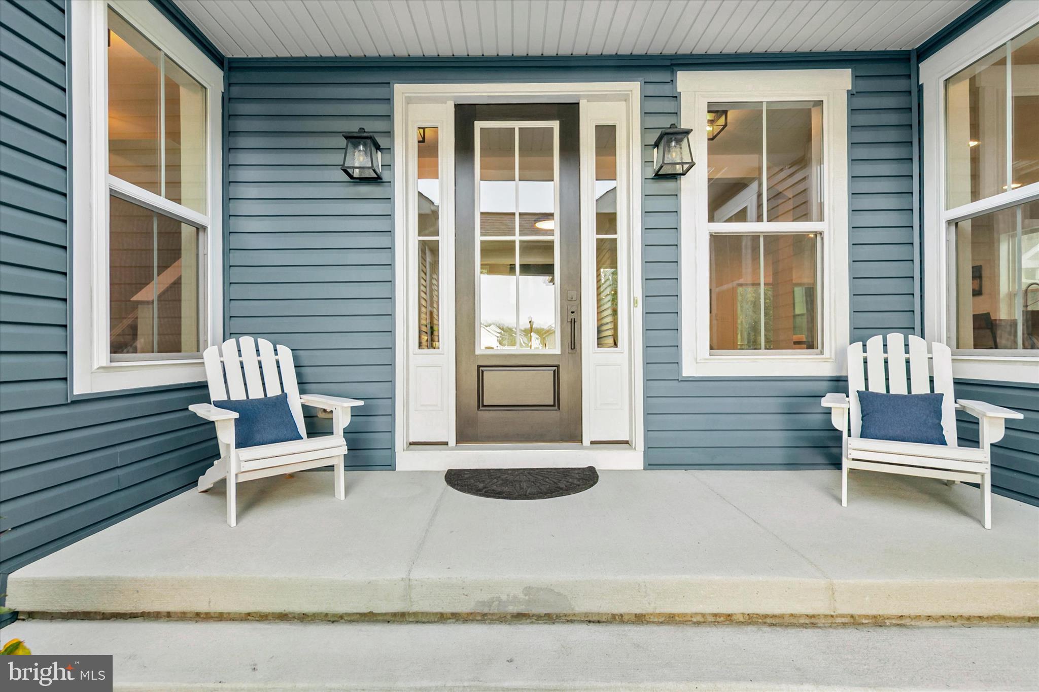36114 Watch Hill Road Frankford, DE 19945 - Photo 4 of 80 a wooden bench sitting in front of a building