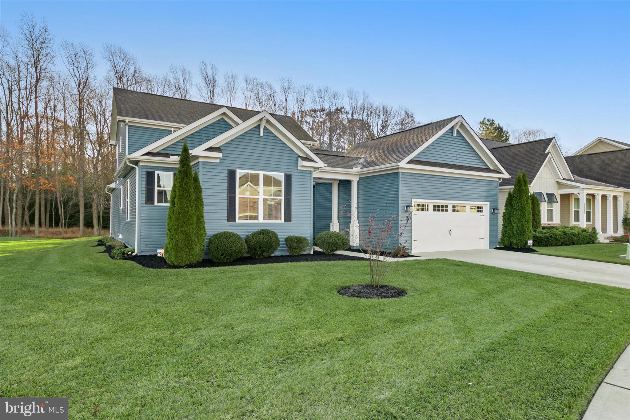 36114 Watch Hill Road Frankford, DE 19945 - Photo 49 of 80 a front view of a house with a yard and garage