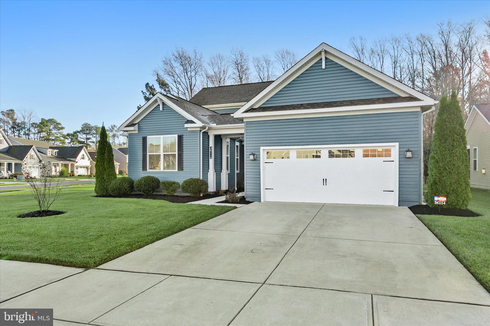 36114 Watch Hill Road Frankford, DE 19945 - Photo 50 of 80 a front view of a house with a yard and garage