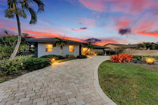 an aerial view of a house with a ocean view