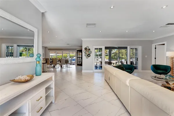 a living room with furniture and white walls
