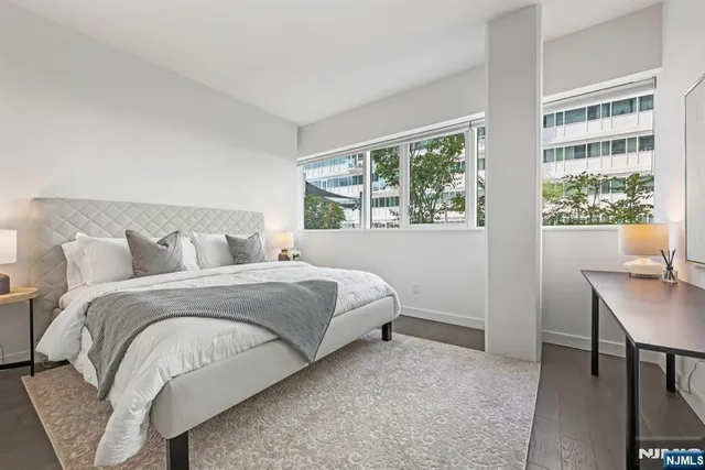 a bedroom with a bed and a table