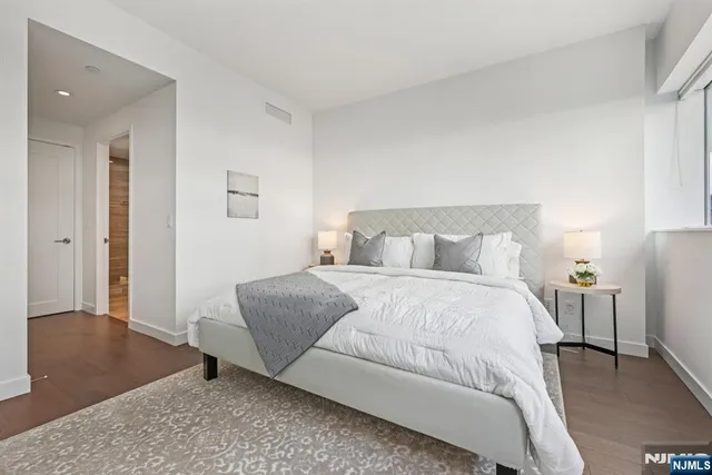 a bedroom with a bed and a couch