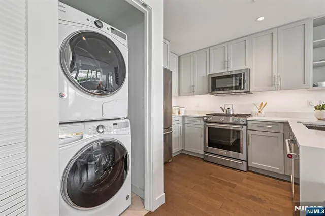 a kitchen with sink a washer and dryer
