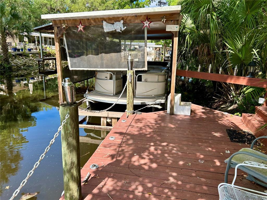 25646 Bass Road Astor, FL 32102 - Photo 7 of 48 an outdoor space with seating