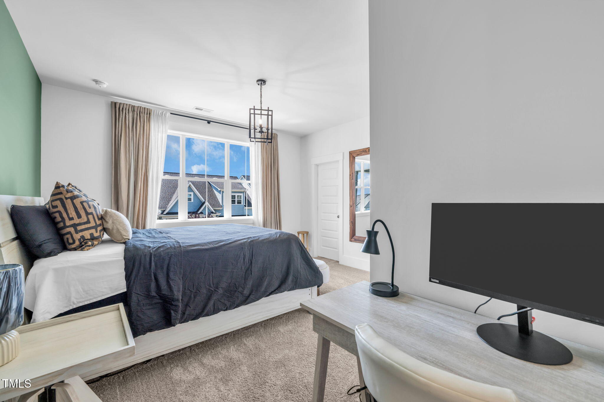 325 Liberty Star Road Wendell, NC 27591 - Photo 49 of 83 a bedroom with a bed and a flat screen tv