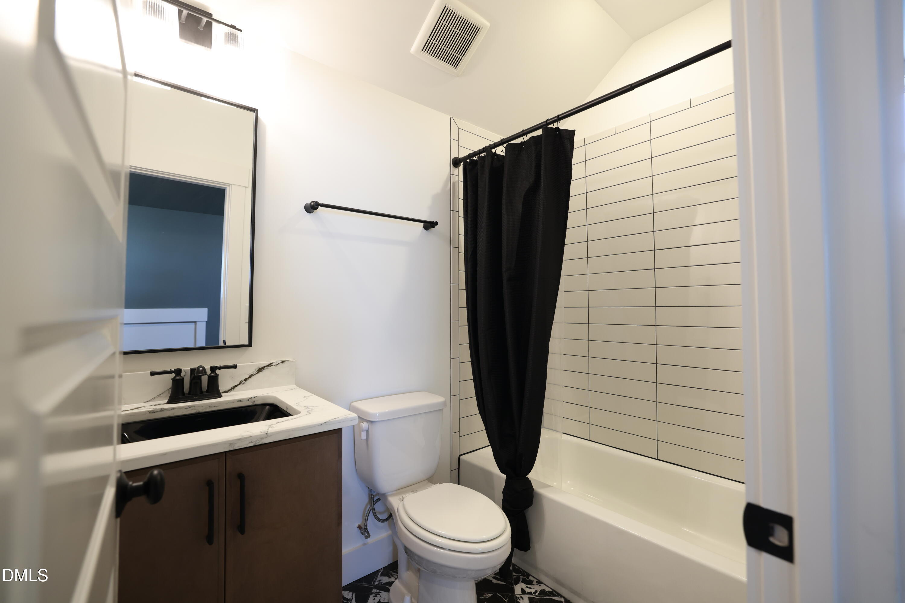 325 Liberty Star Road Wendell, NC 27591 - Photo 57 of 83 a bathroom with a sink a toilet and shower