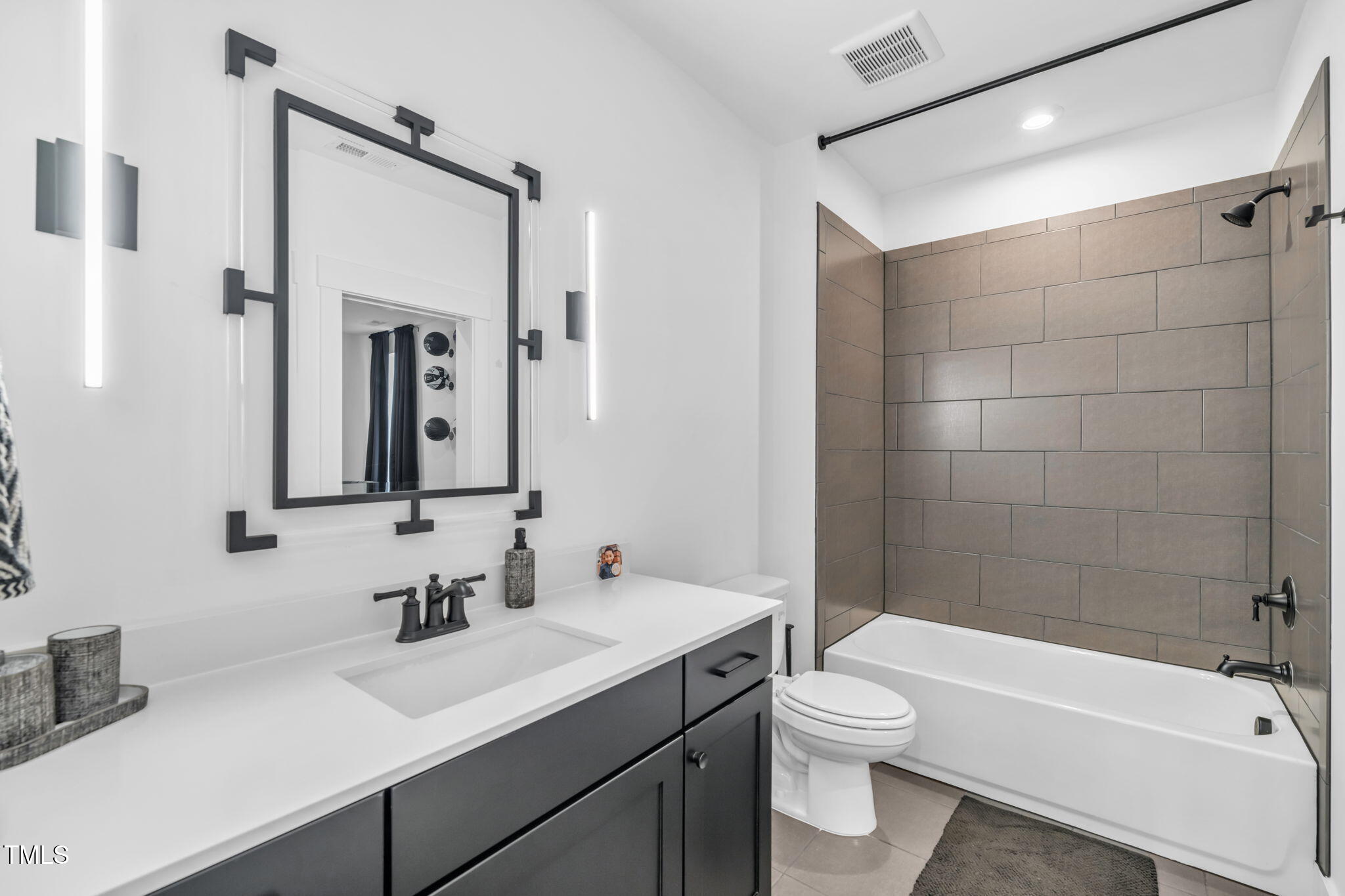 325 Liberty Star Road Wendell, NC 27591 - Photo 62 of 83 a bathroom with a sink a toilet and shower
