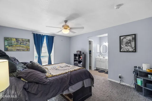 a view of a livingroom with workspace and a window