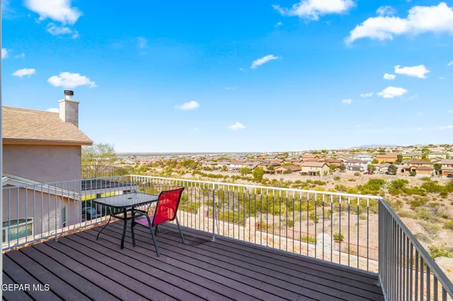 a view of a balcony with furniture