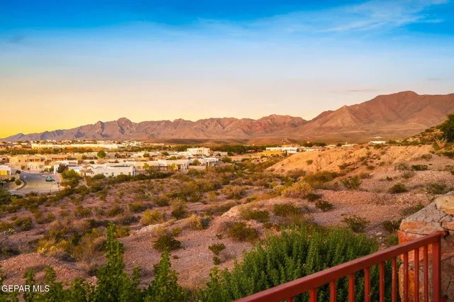 a view of a terrace with furniture and a yard