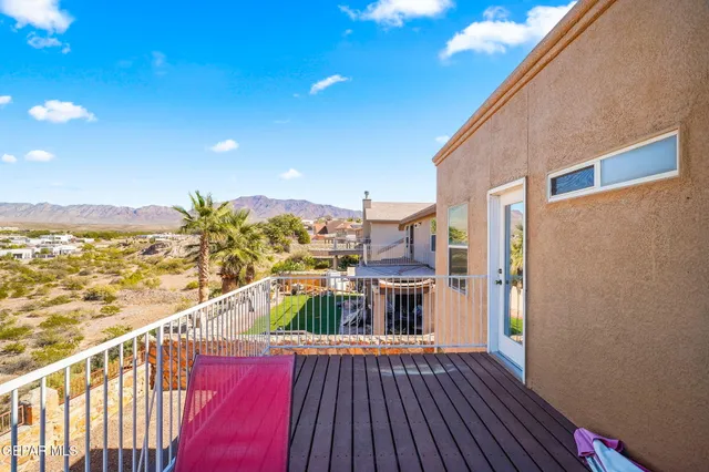 an aerial view of residential houses with city view