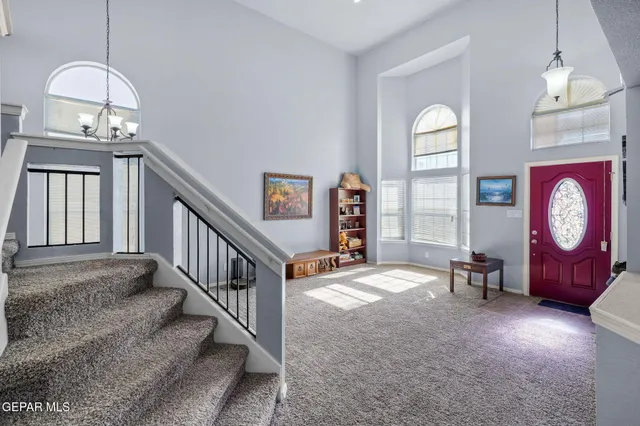 a kitchen with a sink and wooden cabinets