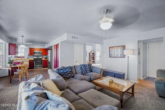 a view of a livingroom with furniture window and a flat screen tv