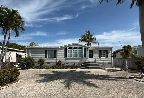 a view of a living room and kitchen