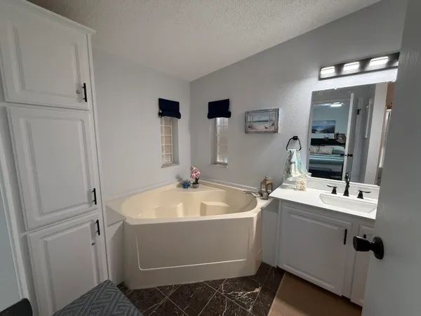 a kitchen with stainless steel appliances granite countertop a refrigerator a stove top oven a sink and dishwasher