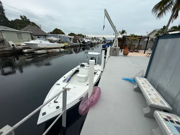 a bed sitting in a bedroom and a mirror