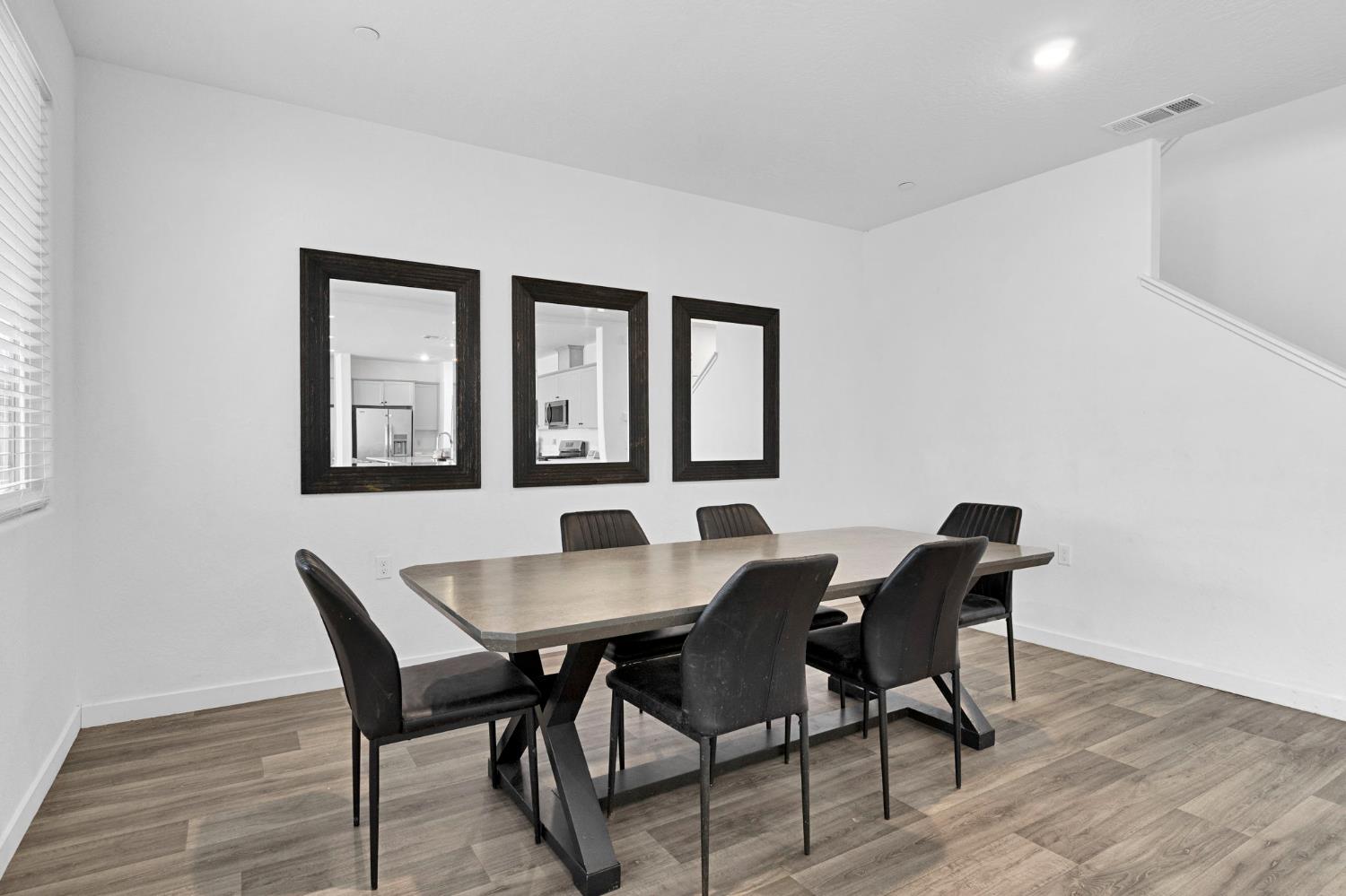 2831 North Redda Road Fresno, CA 93737 - Photo 16 of 41 a view of a dining room with furniture and window