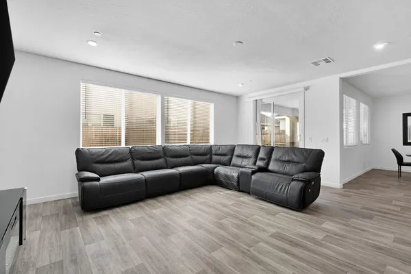 a kitchen with stainless steel appliances a sink stove refrigerator and cabinets