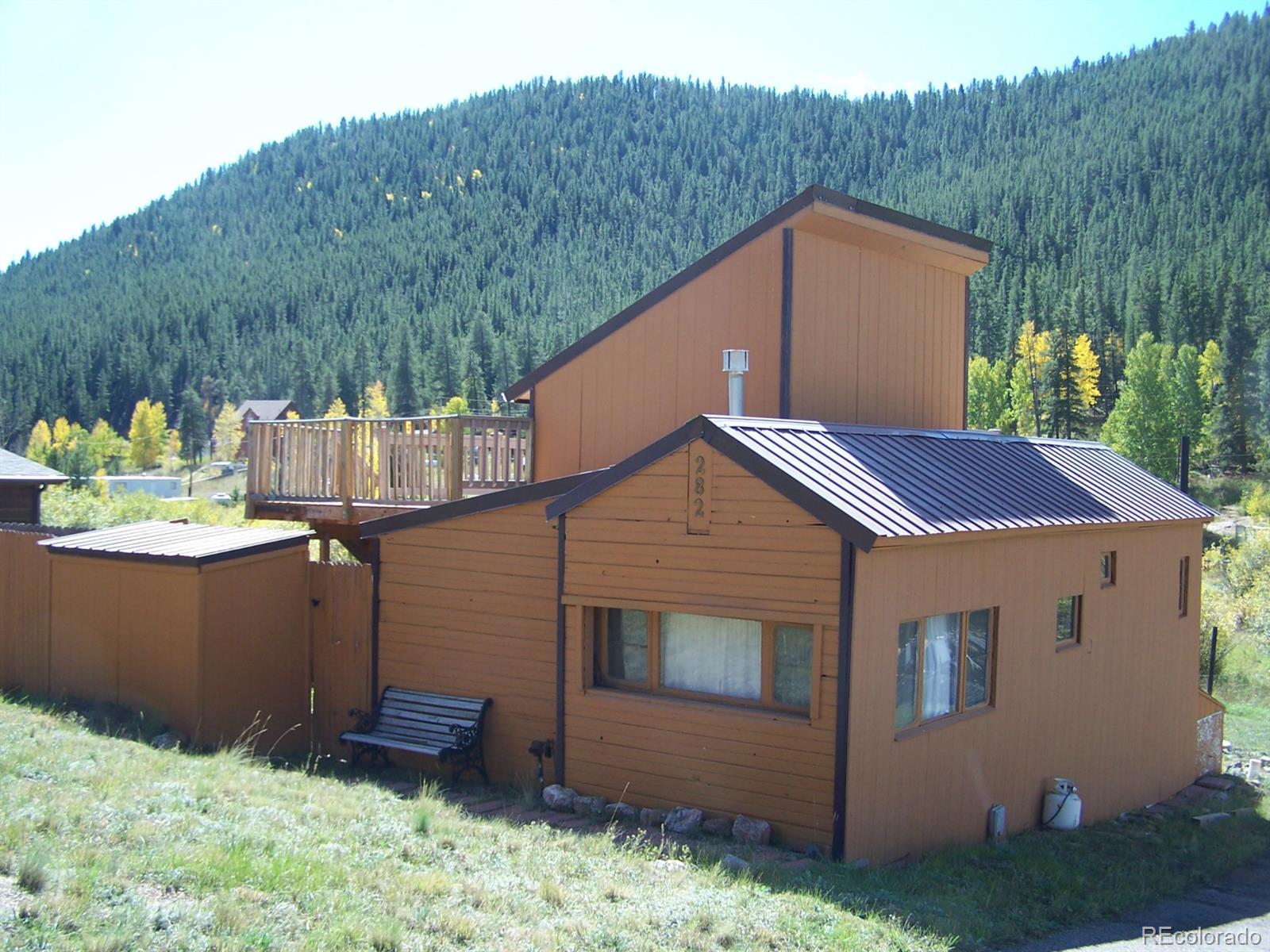 282 Bishop Road Bailey, CO 80421 - Photo 5 of 11 a view of house with backyard